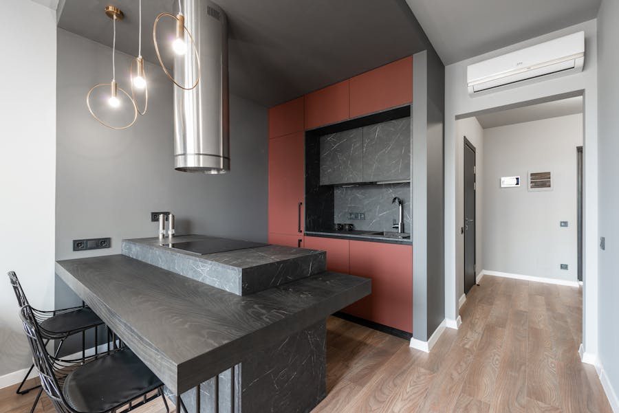 Modern open-plan kitchen with marble island